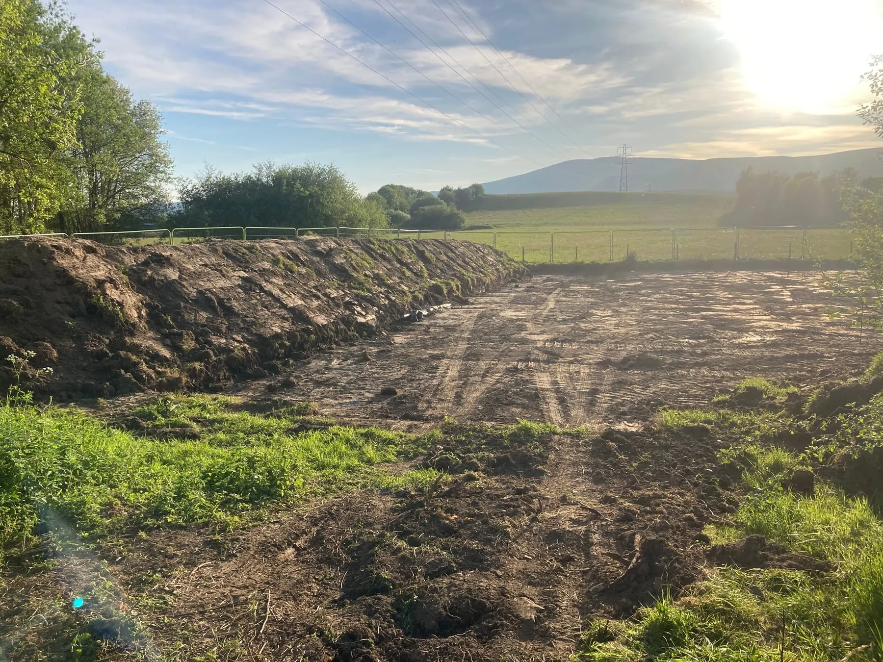 The cleared site for the new base with fells beyond
